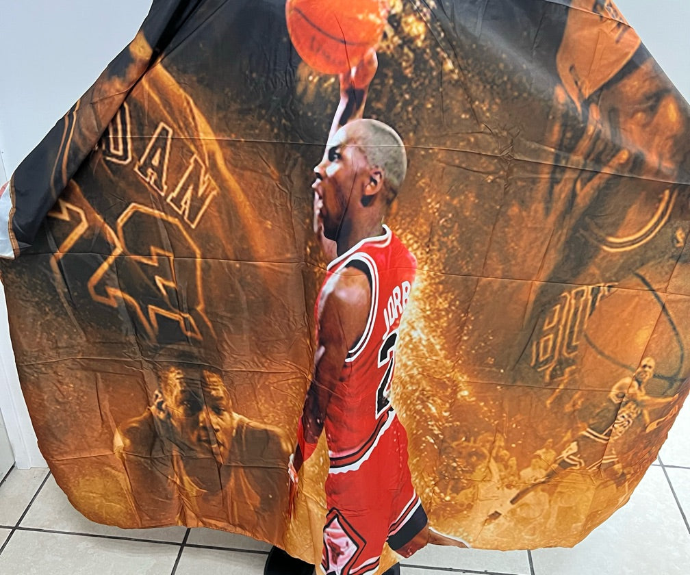 Basketball Edition barber cape product image for professional haircutting service.