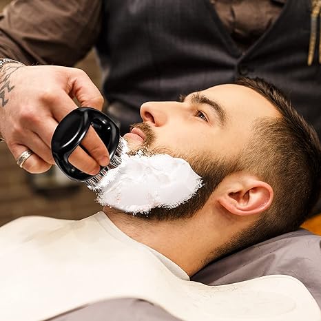 Men's grooming finger brush product image for beard, hair and scalp grooming.