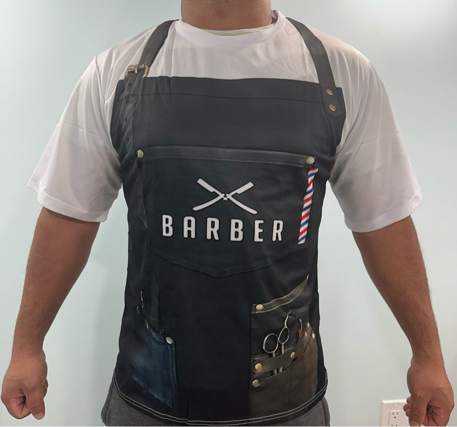 Person wearing a black barber apron with 'BARBER' printed on it against a light background