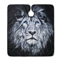Professional black barber cape with a grayscale lion face and vivid blue eyes