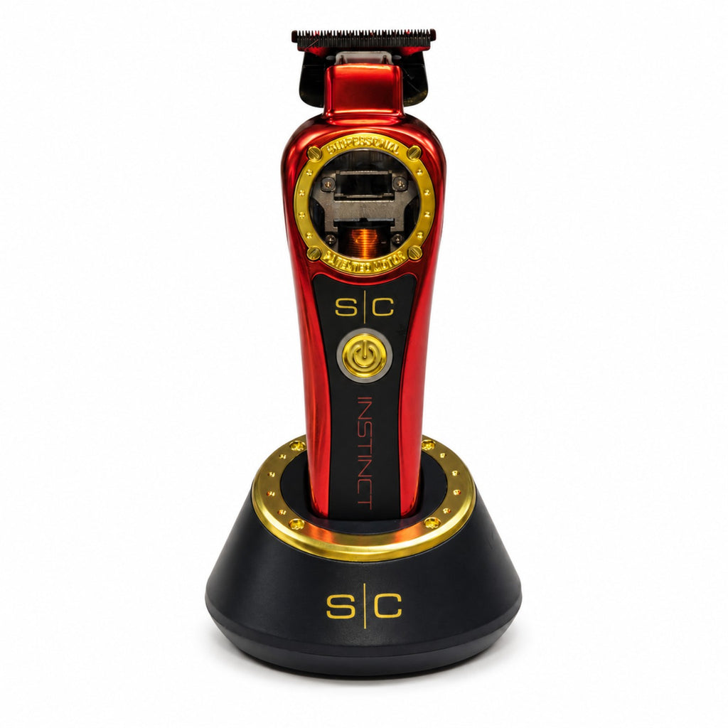 StyleCraft Instinct SC407M cordless trimmer in red on charging stand