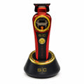 StyleCraft Instinct SC407M cordless trimmer in red on charging stand