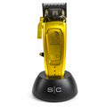 StyleCraft Saber 2.0 Cordless Modular Clipper in Gold with charging stand